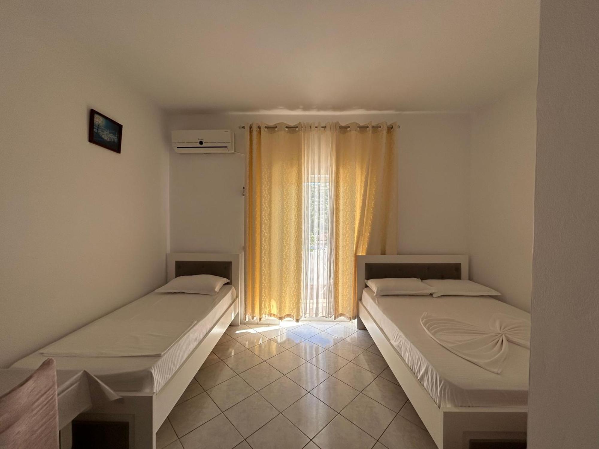 Caushi Apartments Ксамил Экстерьер фото